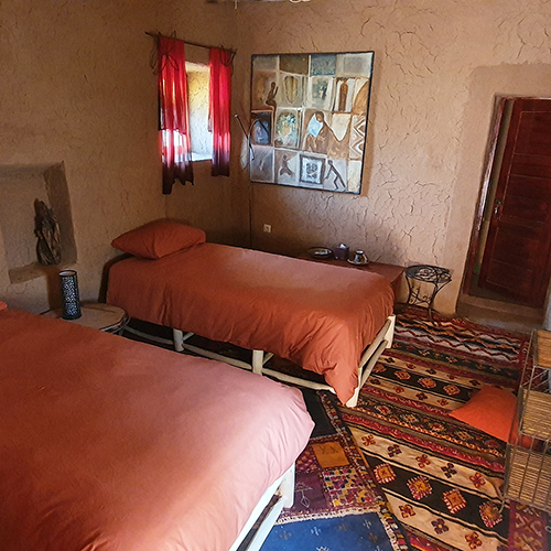 Room with 2 single beds and private bathroom.